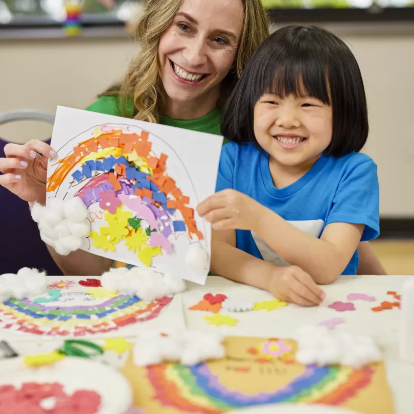 afterschool counselor and child painting