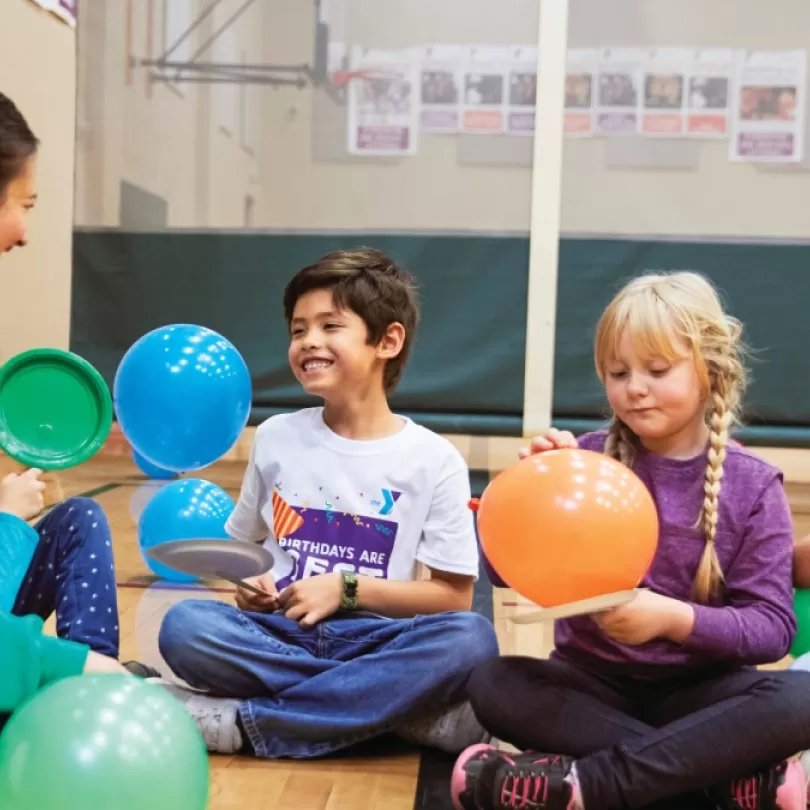 Kids playing with balloons