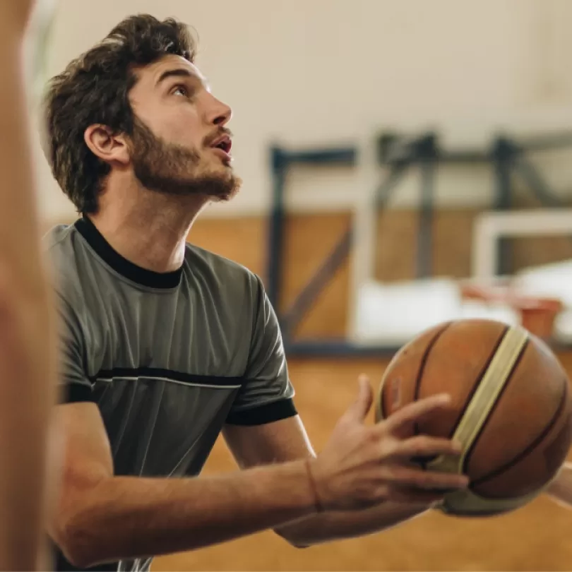 Basketball game in gym.